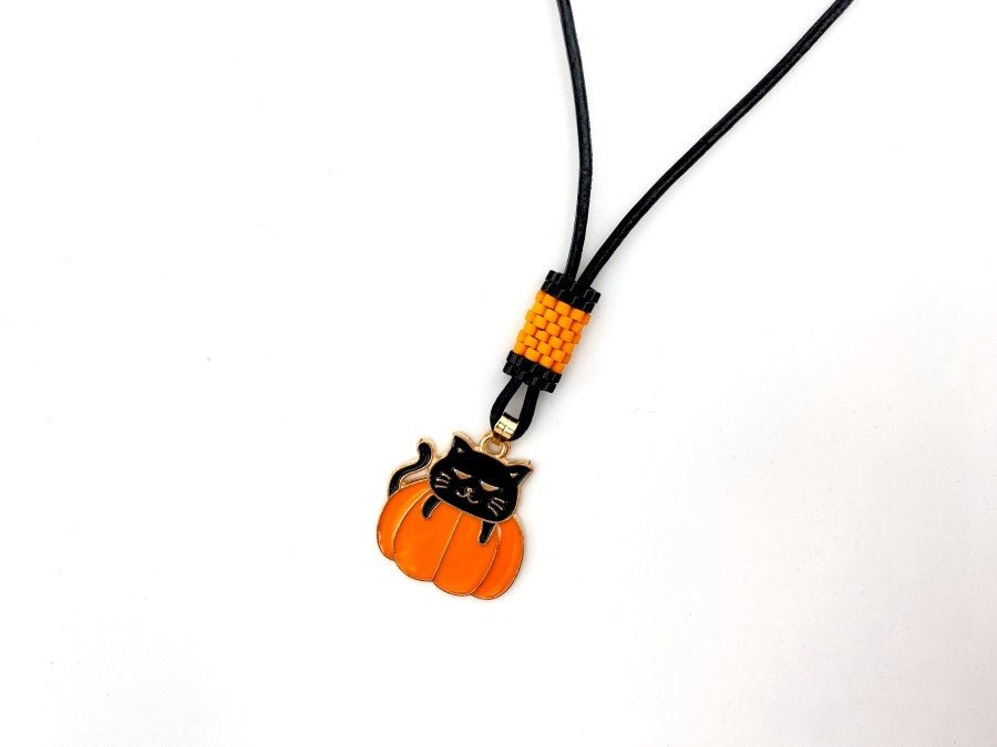 Handmade necklace on leather cord with enameled charm and beaded inlay - Ornamentico shop