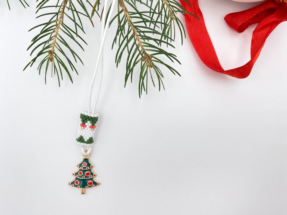 Handmade necklace is featuring elegant charm in the shape of Christmas tree accented with beaded inlay - Ornamentico shop