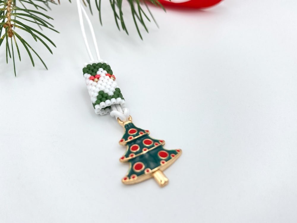 Handmade necklace is featuring elegant charm in the shape of Christmas tree accented with beaded inlay - Ornamentico shop