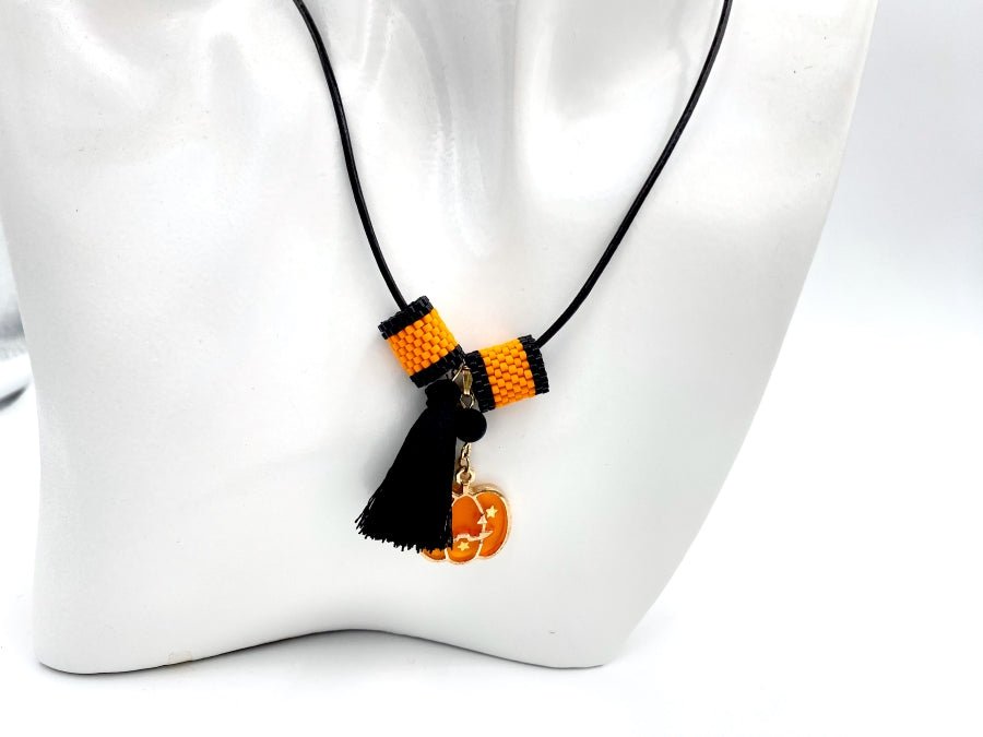 Handmade leather necklace with Halloween pumpkin charm and tassel - Ornamentico shop