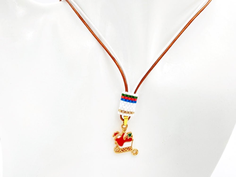 Handmade leather necklace decorated with enameled charm in the shape of Santa accented with beaded inlay - Ornamentico shop