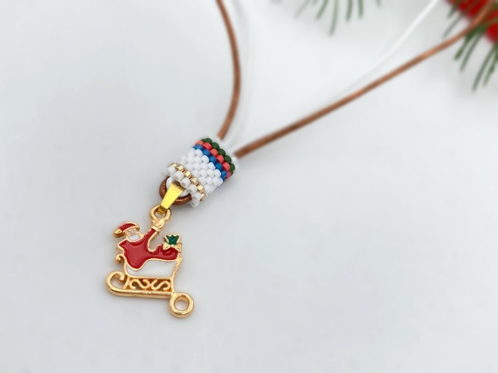 Handmade leather necklace decorated with enameled charm in the shape of Santa accented with beaded inlay - Ornamentico shop