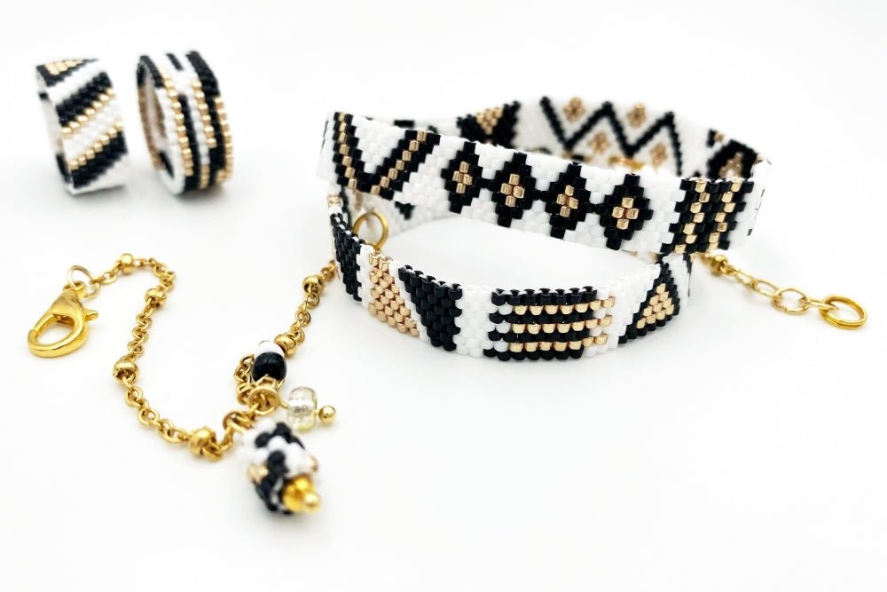 Jewelry set of bracelet and two rings made in geometrical design from black, white and gold Miyuki beads - Ornamentico shop