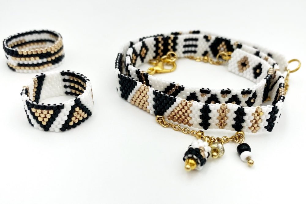 Jewelry set of bracelet and two rings made in geometrical design from black, white and gold Miyuki beads - Ornamentico shop