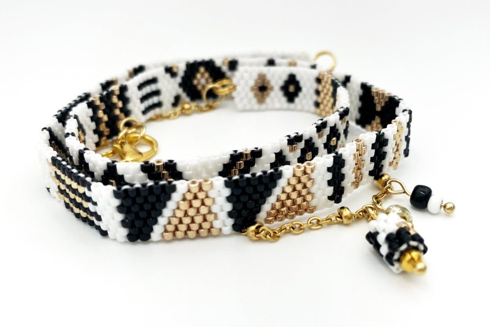 Jewelry set of bracelet and two rings made in geometrical design from black, white and gold Miyuki beads - Ornamentico shop