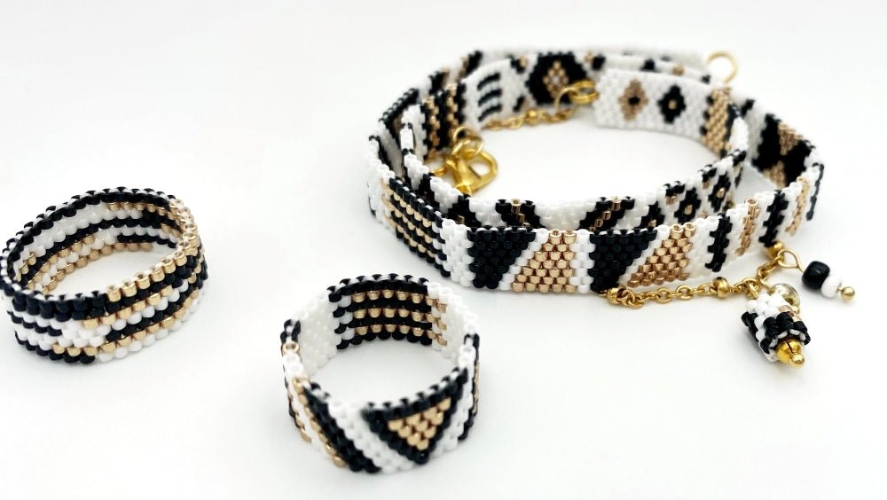 Jewelry set of bracelet and two rings made in geometrical design from black, white and gold Miyuki beads - Ornamentico shop