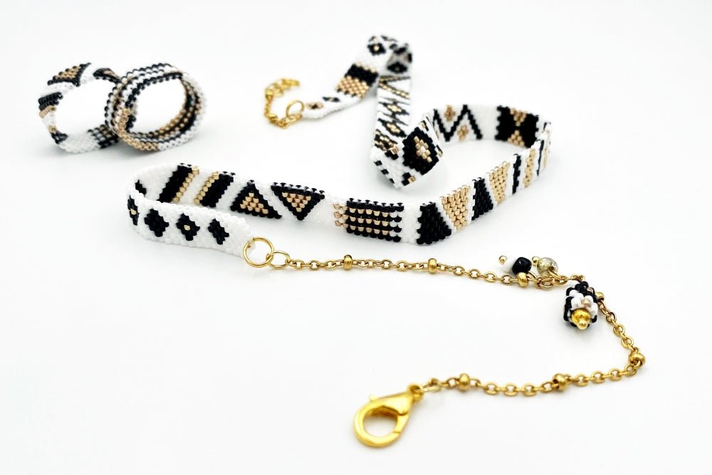 Jewelry set of bracelet and two rings made in geometrical design from black, white and gold Miyuki beads - Ornamentico shop