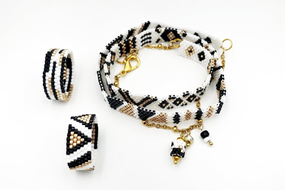 Jewelry set of bracelet and two rings made in geometrical design from black, white and gold Miyuki beads - Ornamentico shop