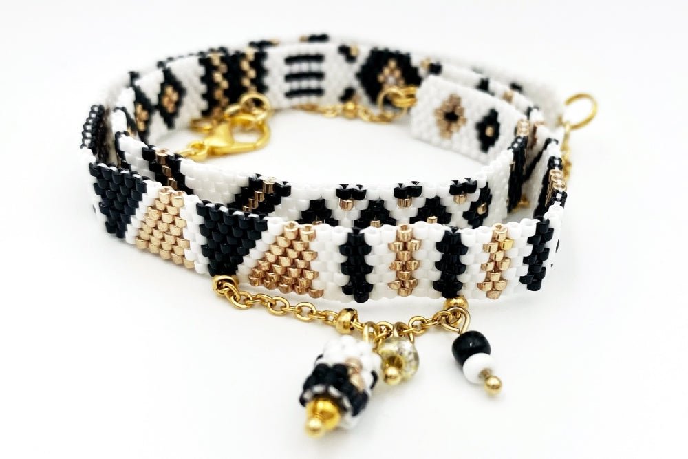 Jewelry set of bracelet and two rings made in geometrical design from black, white and gold Miyuki beads - Ornamentico shop