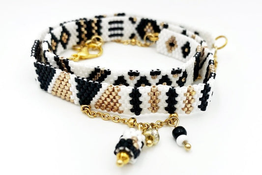 Jewelry set of bracelet and two rings made in geometrical design from black, white and gold Miyuki beads - Ornamentico shop