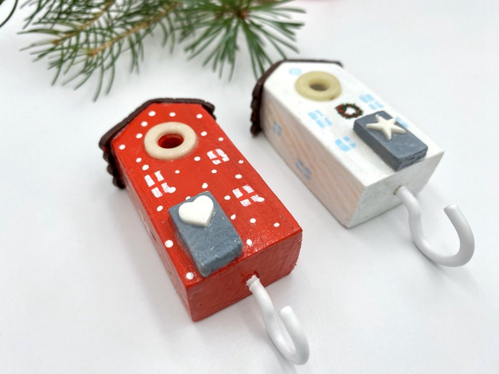 Two handmade wooden hooks in the shape of Christmas decorated houses - Ornamentico shop