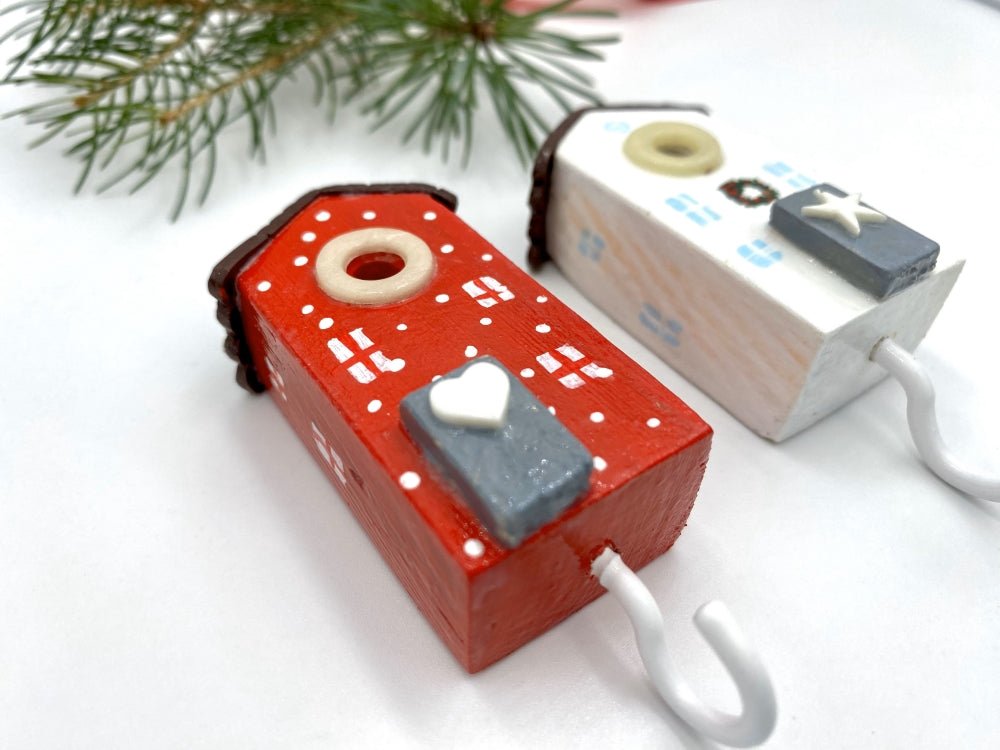 Two handmade wooden hooks in the shape of Christmas decorated houses - Ornamentico shop