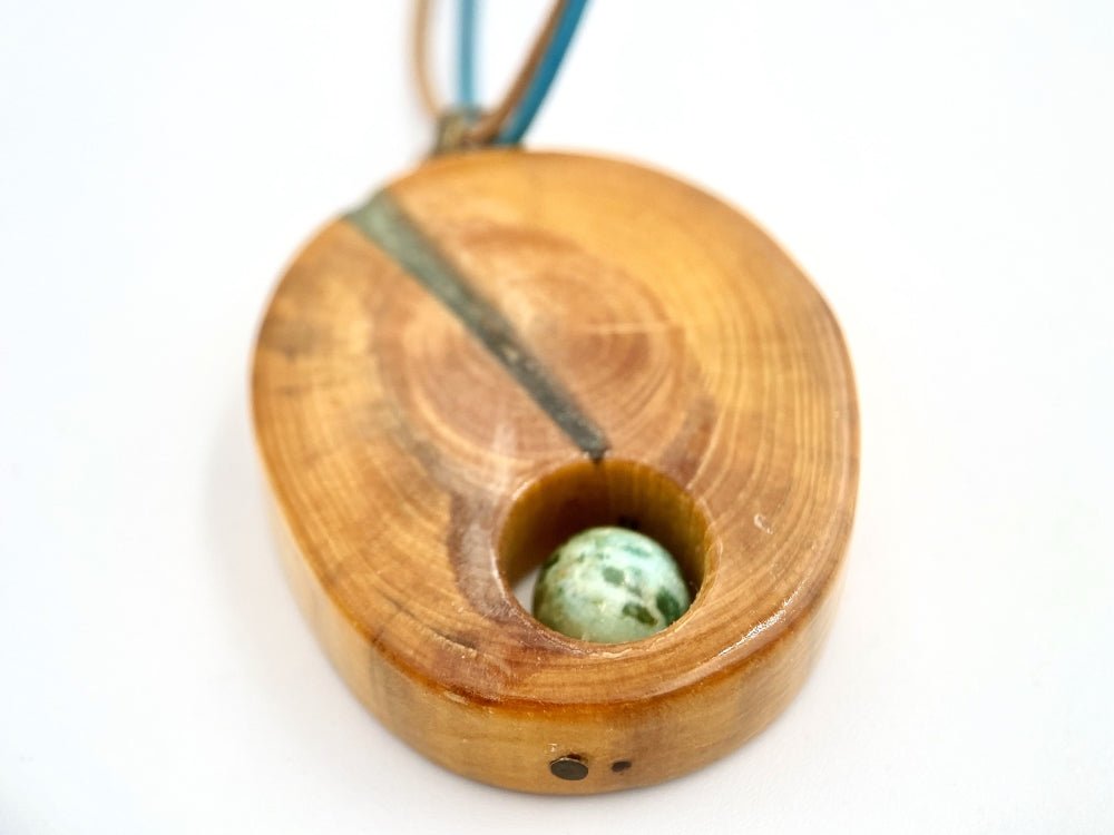 Handmade wooden pendant. Made of polished and lacquered beech wood with one Peruvian turquoise stone - Ornamentico shop
