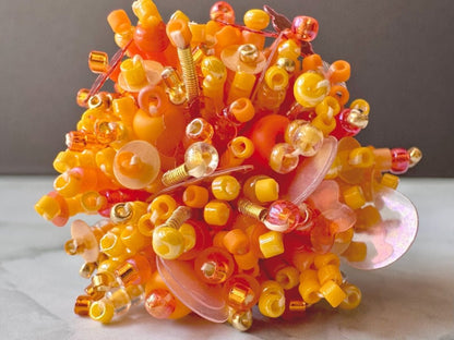 Colorful ring crafted in volume-beading technique from bright orange beads and sequins imitating a blossoming flowerbed - Ornamentico 