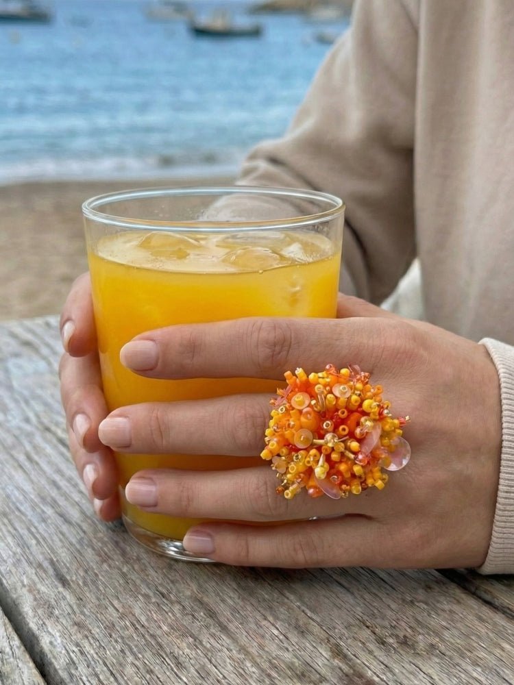 Colorful ring crafted in volume-beading technique from bright orange beads and sequins imitating a blossoming flowerbed - Ornamentico shop