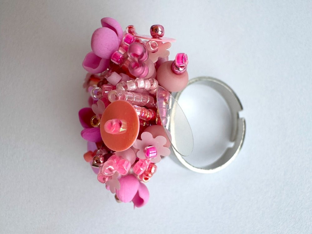Handmade volume-beaded statement ring with floral design, polymer clay & sequins in pink hues - Ornamentico shop