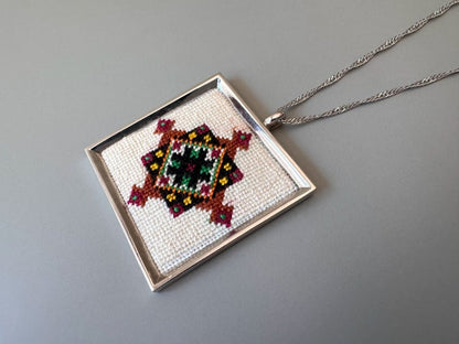 Unique hand embroidered pendant in oriental design, set in custom silver frame - Ornamentico shop