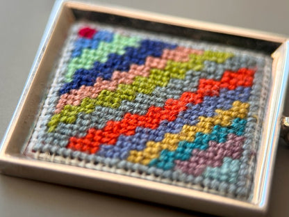 Unique hand embroidered pendant in oriental Peruvian design, set in custom silver frame - Ornamentico shop