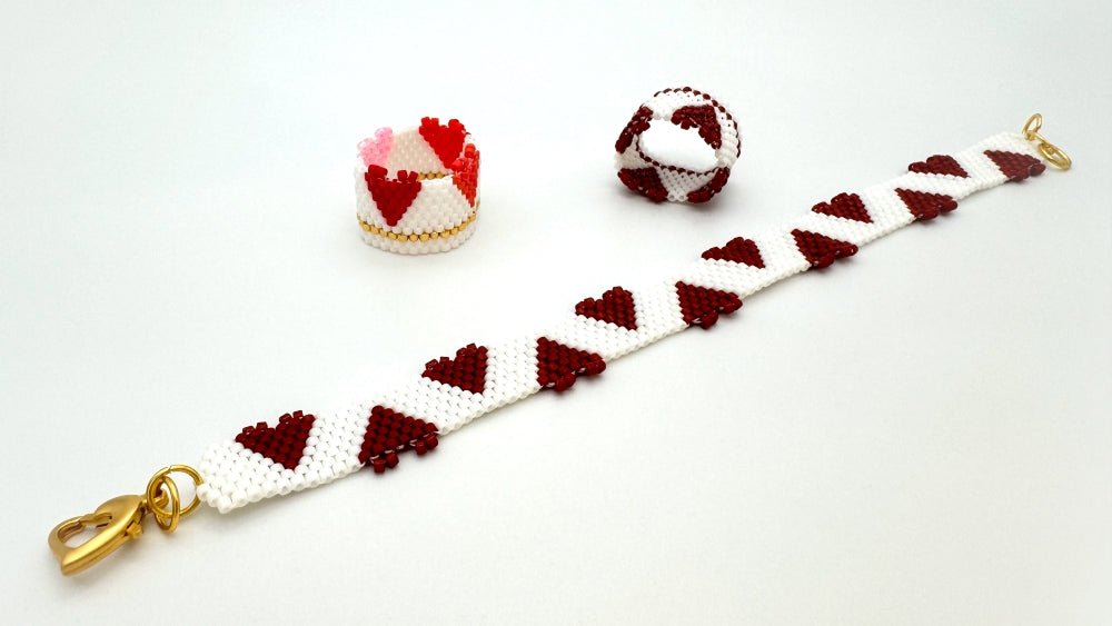 Beaded bracelet made in peyote stitch technique featuring bright red hearts standing out from bracelet's edge