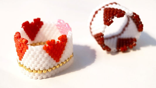 Beaded ring crafted in peyote stitch technique featuring bright hearts standing out from the ring's edge