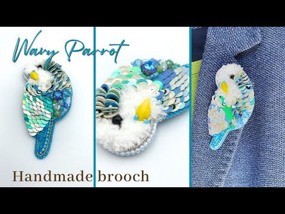 Handmade brooch in the shape of an azure blue wavy parrot made from beads and sequins - Ornamentico shopHandmade brooch in the shape of an azure blue wavy parrot made from beads and sequins - Ornamentico shop