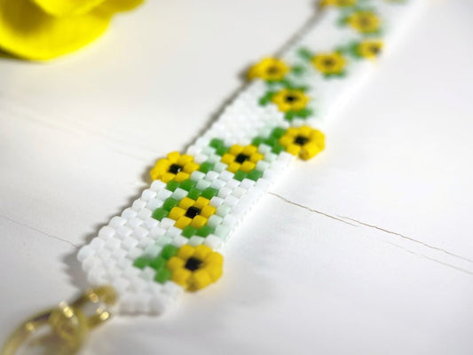 Beaded bracelet with bright sunflowers crafted in peyote stitch technique from Miyuki Delica beads