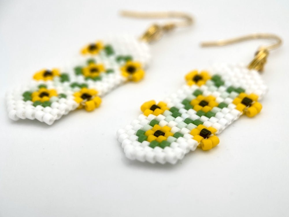 Beaded earrings featuring bright sunflowers crafted in peyote stitch technique with Miyuki Delica beads