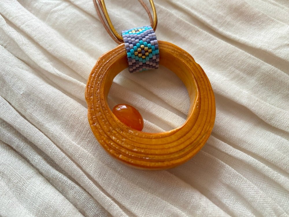 Wooden pendant with amber, crafted from polished and lacquered beech wood - Ornamentico shop