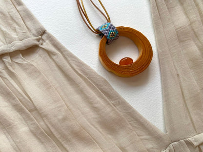 Wooden pendant with amber, crafted from polished and lacquered beech wood - Ornamentico shop