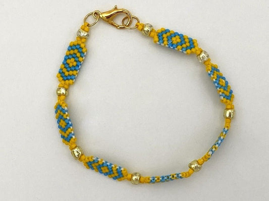 Handmade bracelet crafted from Japanese beads Miyuki in which Eastern design meets Ukrainian flag colors