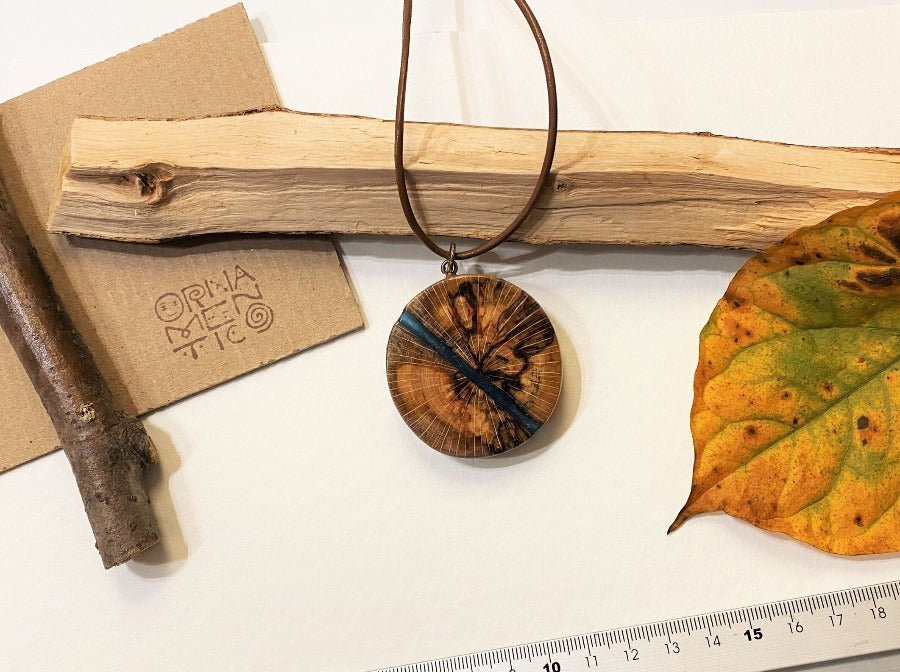 Polished and lacquered wooden pendant with sea colored epoxy inlay - Ornamentico shop