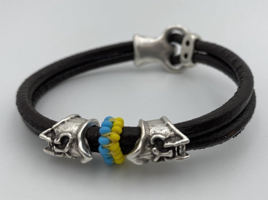 Handmade men's bracelet from leather decorated with two large helmet beads and insert from color beads - Ornamentico shop