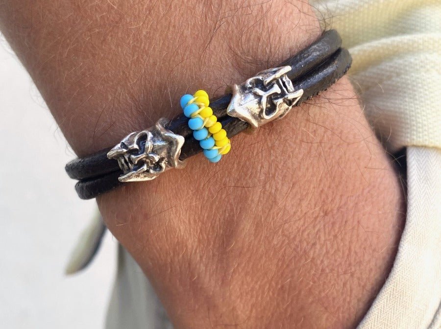 Handmade men's bracelet from leather decorated with two large helmet beads and insert from color beads - Ornamentico shop