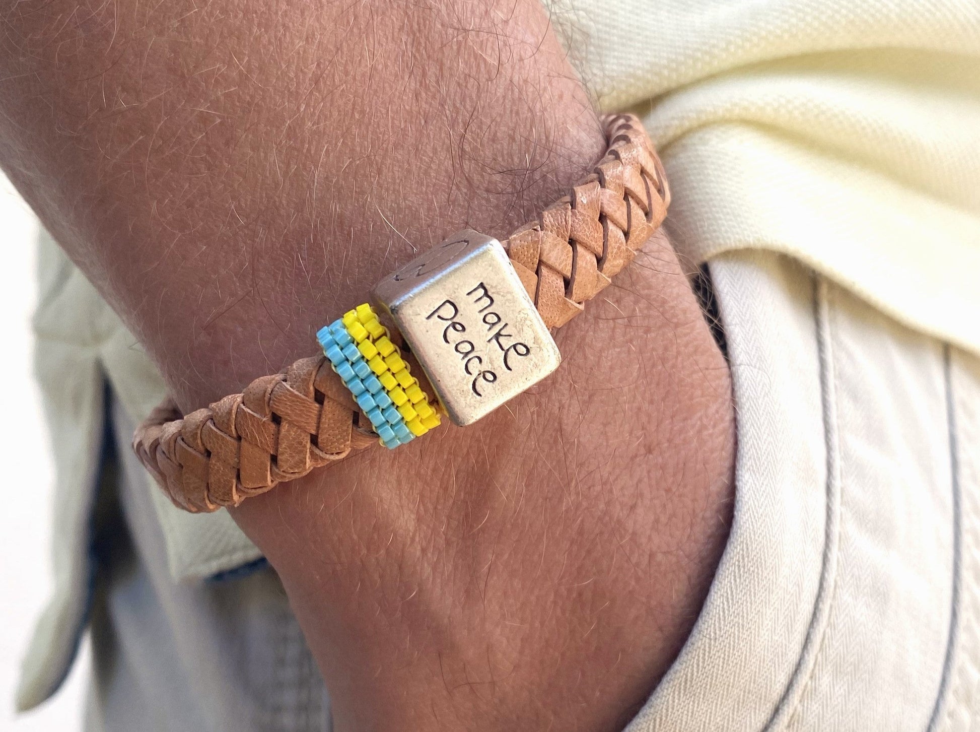 Handmade men's bracelet from leather decorated with large cube bead and insert from beads Miyuki. Beaded insert is made in Ukrainian flag colors - Ornamentico shop