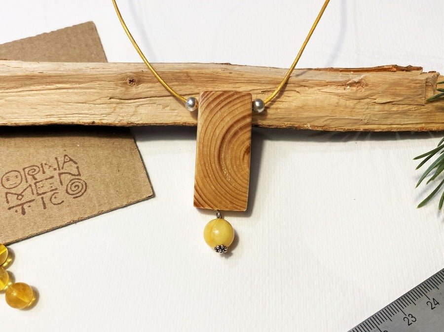 Lacquered wooden pendant with amber bead. Beech wood, Baltic amber beads, silver coated fittings - Ornamentico shop