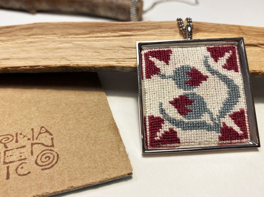 Unique handmade embroidered pendant in a silver frame. Collection "Barcelona Tiles"