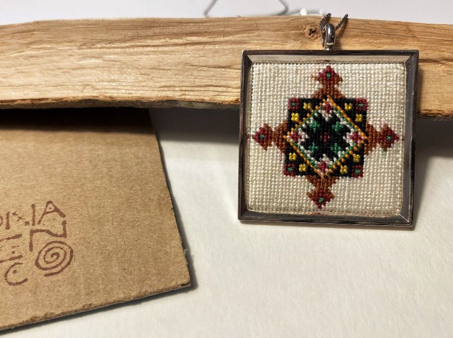 Unique handmade embroidered pendant in a silver frame. Collection "Carpets of Anatolia"