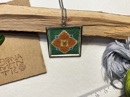 Unique handmade embroidered pendant in a silver frame. Collection "Carpets of Anatolia" - Ornamentico shop