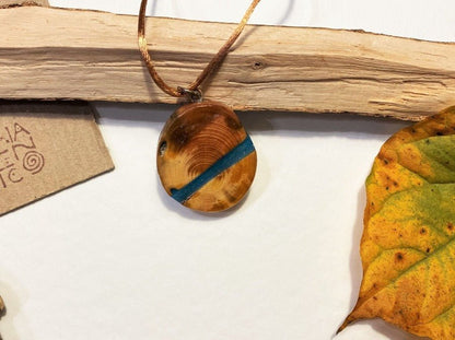 Handmade wooden pendant. Made of polished and lacquered beech with sea colored epoxy inlay - Ornamentico shop
