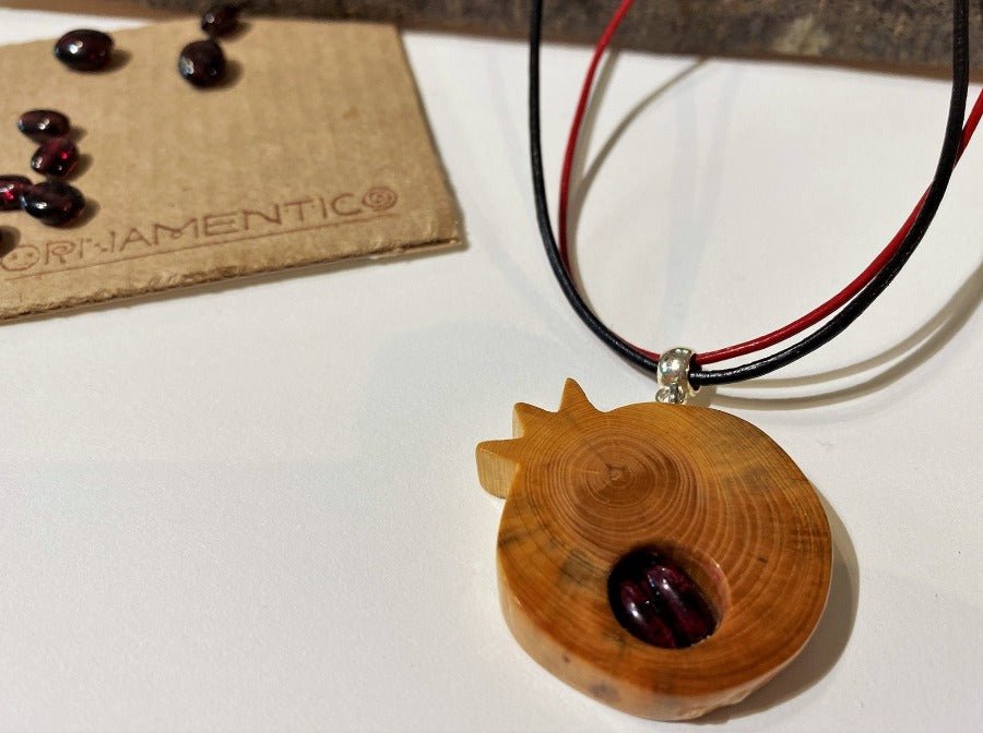 Handmade wooden pendant with garnet beads. Made of beech wood and complimented with two garnet beads - Ornamentico shop