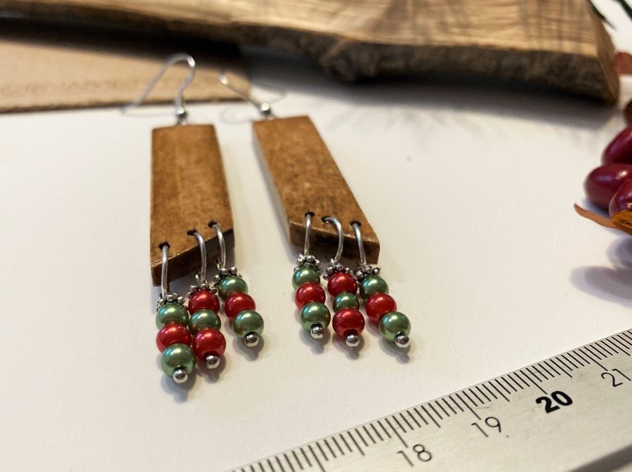 Graceful long Boho style wooden earrings with beads. Polished and lacquered wood with green and red beads - Ornamentico shop
