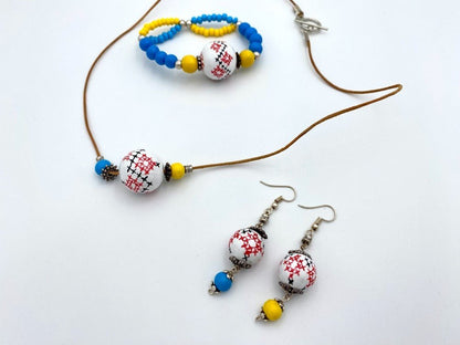 Delicate earrings from hand painted wooden beads "Embroidery" crafted in colors of Ukrainian flag- Ornamentico shop