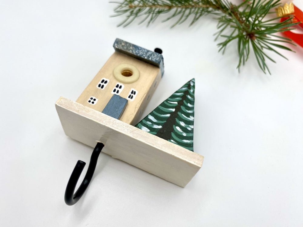 Wooden hand painted hook in the shape of a winter house and a spruce - Ornamentico Shop