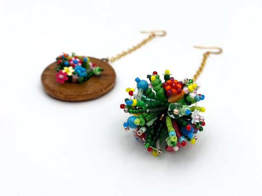 Handmade asymmetric earrings made in sculptural beading technique featuring bright floral design accented by wood - Ornamentico Group