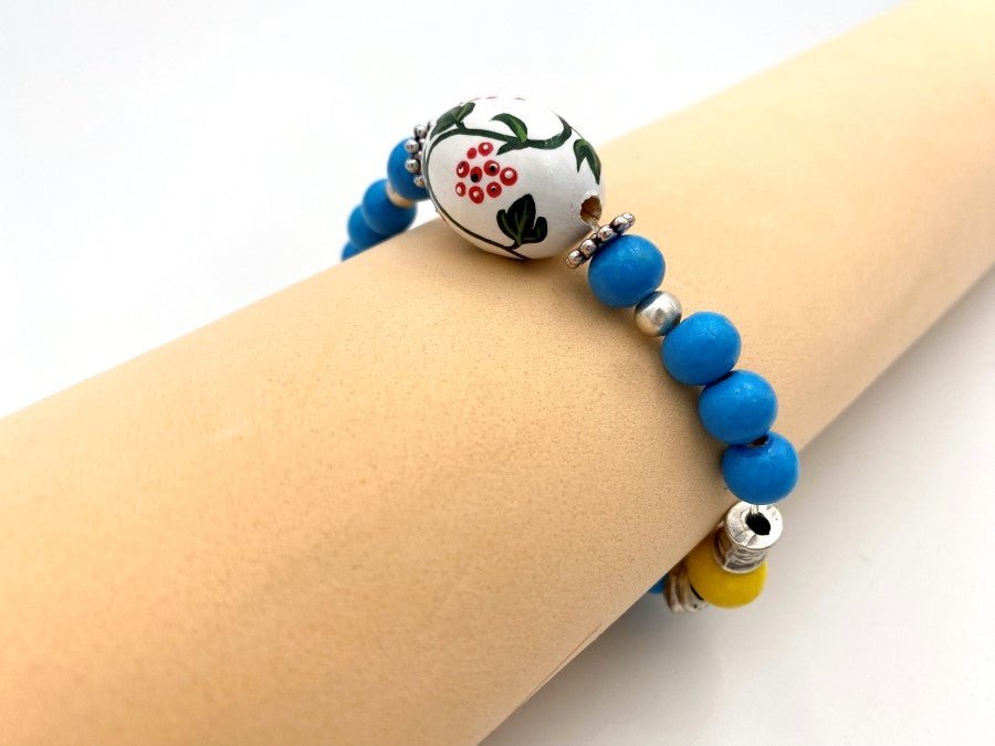 Boho style elegant bracelet from hand painted wooden beads "Kalyna" crafted in colors of Ukrainian flag - Ornamentico shop