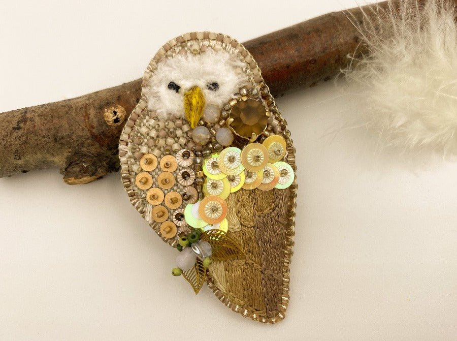This handmade brooch features an owl design made from a combination of beads, sequins, and embroidery - Ornamentico shop
