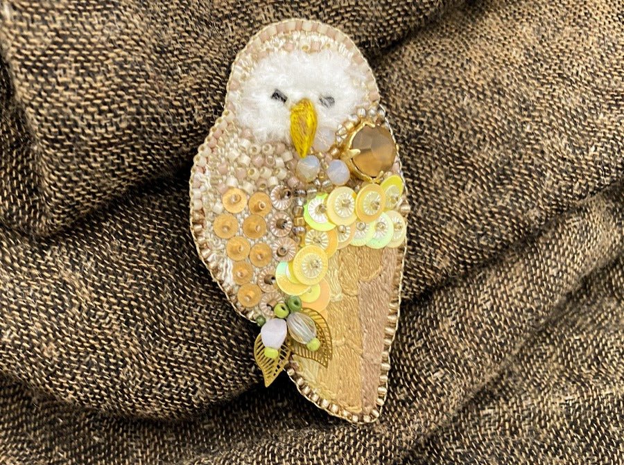 This handmade brooch features an owl design made from a combination of beads, sequins, and embroidery - Ornamentico shop