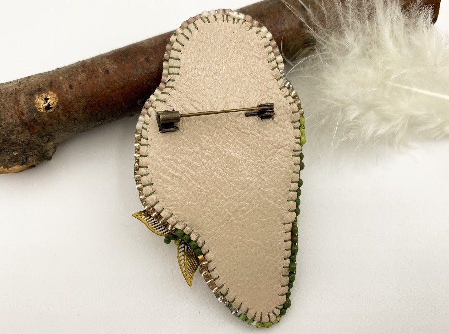 This handmade brooch features an owl design with a beige base, and shades of green colors - Ornamentico shop