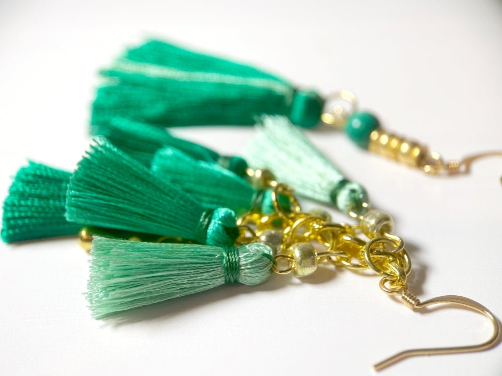 Handmade asymmetric earrings with emerald green tassels, malachite bead and gold-platted fittings - Ornamentico shop