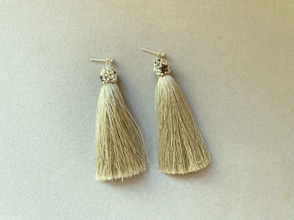 Handmade earrings are crafted from a shimmering mint tassel which is covered with a floral cap - Ornamentico shop